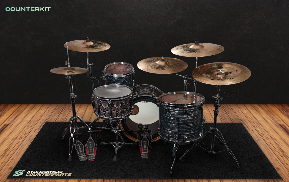 A screenshot of the Counterkit UI showing Kyle's drumkit in a wooden studio background.
